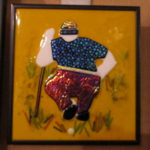 Golfer on Marigold Glass Wall Art